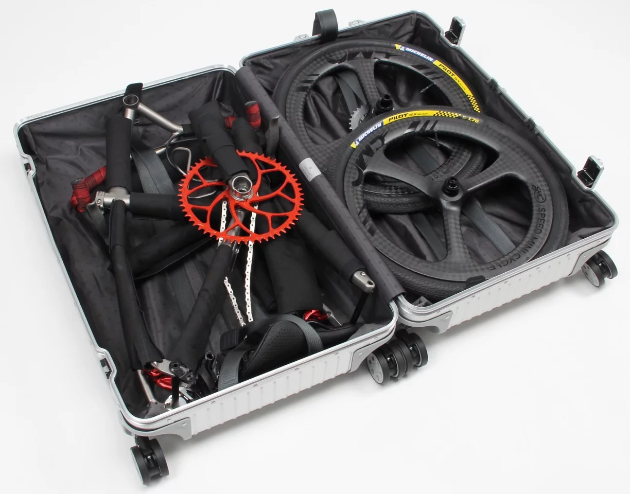 17-lb titanium Firefly MiniVelo bike globetrots in a Rimowa suitcase 17-lb titanium Firefly MiniVelo bike globetrots in a Rimowa suitcase